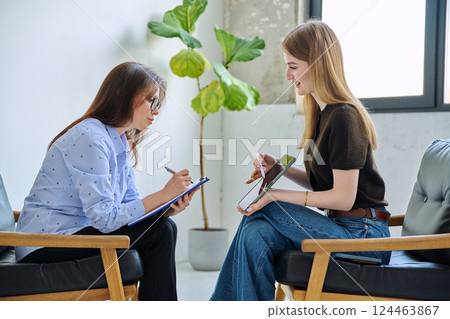 Mental therapy, female professional psychologist working with young woman patient Mental therapy, female professional psychologist working with young woman patient 124463867