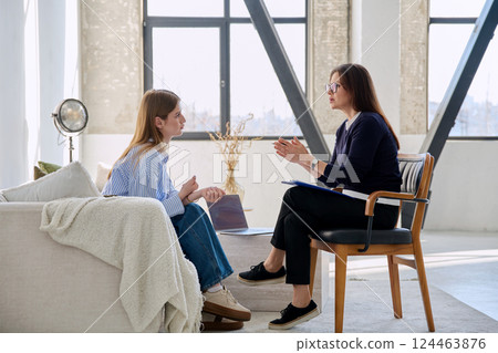Young woman patient during therapy session in professional mental therapist's office 124463876