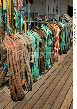 Marine equipment on the deck of a ship. Marine ropes and different tackles. Marine equipment on the deck of a ship. Marine ropes and different tackles. 124464100