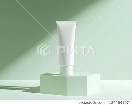 Minimalist white cream tube for mockup displayed on a pastel green platform under soft lighting 124464307