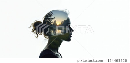 The silhouette of a female head depicting a calm and relaxed landscape, relaxation exercises, stress management and positive thinking 124465326