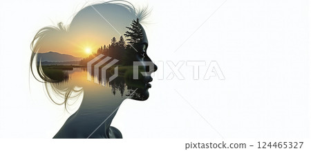 The silhouette of a female head depicting a calm and relaxed landscape, relaxation exercises, stress management and positive thinking 124465327