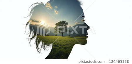 The silhouette of a female head depicting a calm and relaxed landscape, relaxation exercises, stress management and positive thinking 124465328