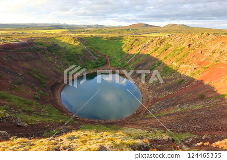 Sunset trekking around a beautiful crater lake 124465355