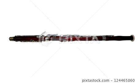 A beautifully crafted wooden bassoon lies flat on a smooth surface, showcasing its intricate keys and rich color. It is ready for use in a music rehearsal, reflecting fine craftsmanship. 124465860