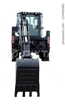 Excavator loader positioned to dig into the earth at a construction site. It features a front bucket ready for heavy lifting, showcasing its hydraulic arm and sturdy design. 124465862