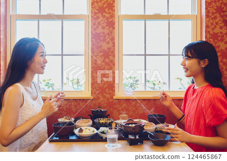 A woman dining at a restaurant A woman dining at a restaurant 124465867