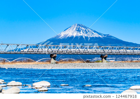 Tokaido Shinkansen N700 series crossing the Fuji River Bridge with Mt. Fuji in the background Tokaido Shinkansen N700 series crossing the Fuji River Bridge with Mt. Fuji in the background 124467918