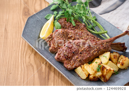 Lamb chop steak with watercress and potatoes Lamb chop steak with watercress and potatoes 124469928