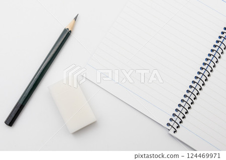 Notes and pencil and eraser Notes and pencil and eraser 124469971