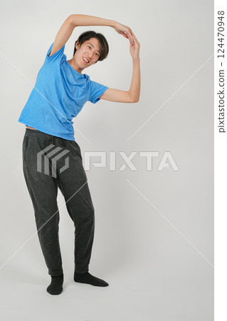 A man making a circle with his arm A man making a circle with his arm 124470948