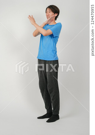 A man making a cross sign with his arm A man making a cross sign with his arm 124470955