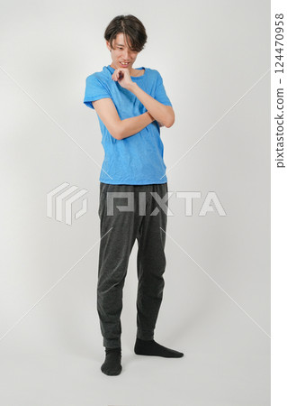 A man thinking with his hand on his chin 124470958