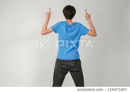 A man facing backwards and pointing up A man facing backwards and pointing up 124471007