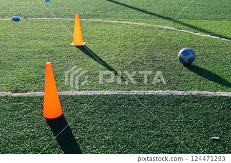 artificial green grass soccer field with orange training cones artificial green grass soccer field with orange training cones 124471293