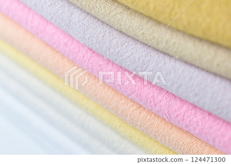 stack of colourful cotton clothes, close up pile of clothing stack of colourful cotton clothes, close up pile of clothing 124471300