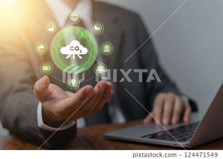 businessman holding a digital CO2 sustainability, representing efforts to reduce carbon emissions. eco-friendly technology, renewable energy, and environmental conservation in modern business. 124471549
