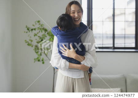 A family relaxing in the living room A family relaxing in the living room 124474977