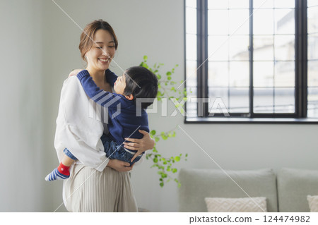 A family relaxing in the living room A family relaxing in the living room 124474982
