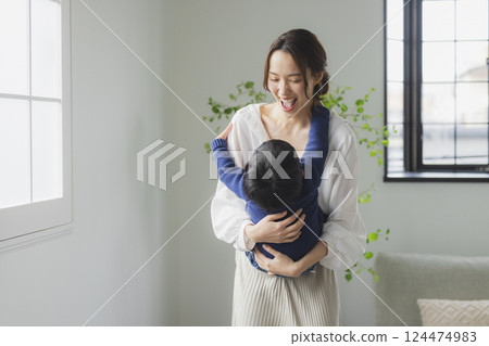 A family relaxing in the living room 124474983