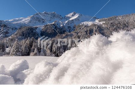Snowy scenery on a sunny day in the Bavarian Alps, in Oberstdorf, Germany 124476108