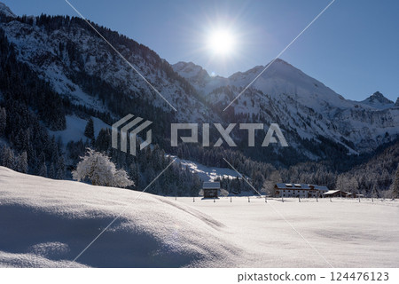 Snowy alpine scenery on a sunny day in December in Oberstdorf, Germany 124476123