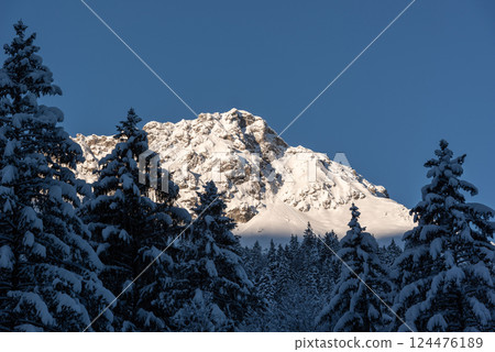 Snow-covered mountain peaks on a beautiful sunny day, in the Bavarian Alps 124476189