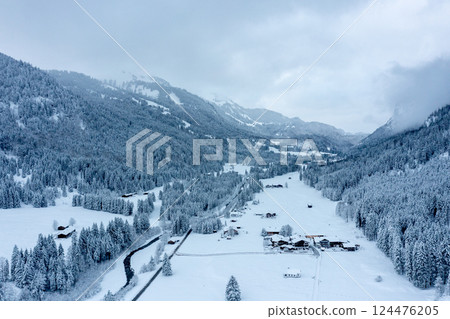 Winter scenery, drone image with snowy valley in the Bavarian Alps, Germany Winter scenery, drone image with snowy valley in the Bavarian Alps, Germany 124476205