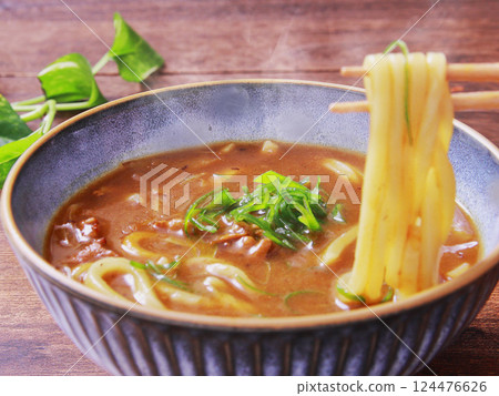 Curry udon with chopsticks Curry udon with chopsticks 124476626