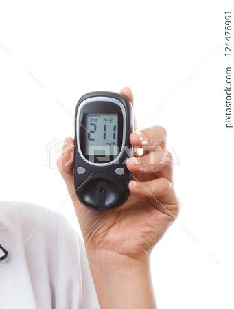 Hand of doctor holding glucometer with high result of sugar level 124476991