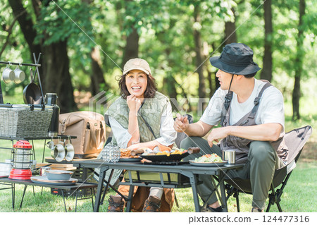 Couples and families enjoying camping at a campsite 124477316
