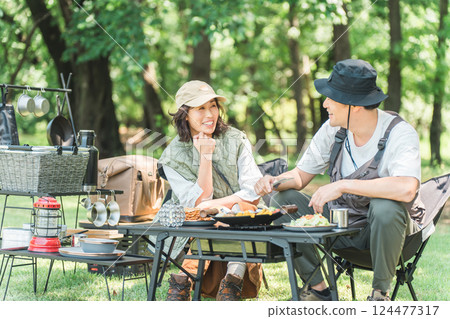 Couples and families enjoying camping at a campsite 124477317