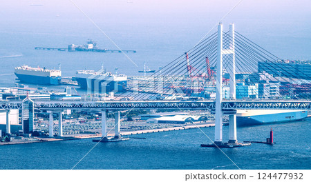 Yokohama cityscape, Japan. The impact of tariffs... Dark clouds over the Japanese automobile industry... Tokyo Bay hazy with yellow sand... Car carrier at Daikoku Wharf Yokohama cityscape, Japan. The impact of tariffs... Dark clouds over the Japanese automobile industry... Tokyo Bay hazy with yellow sand... Car carrier at Daikoku Wharf 124477932