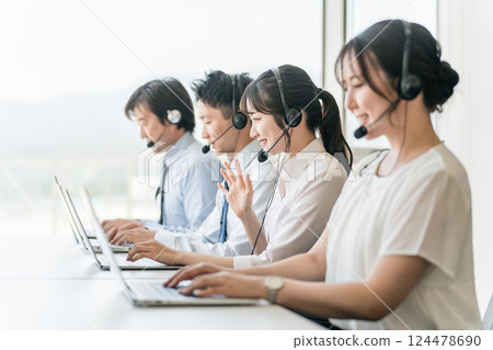 Men and women of the call center operator team (teleoperation/teleappointment) Men and women of the call center operator team (teleoperation/teleappointment) 124478690