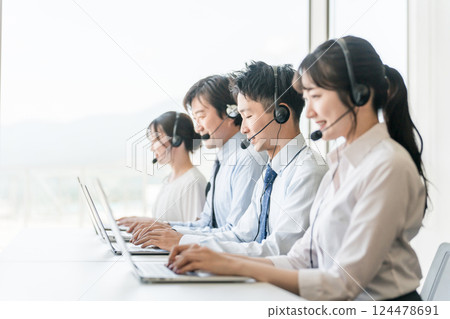 Men and women of the call center operator team (teleoperation/teleappointment) 124478691
