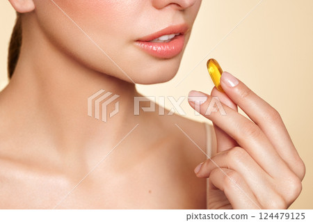 Beautiful Girl With Pill With Cod Liver Oil Omega-3 124479125