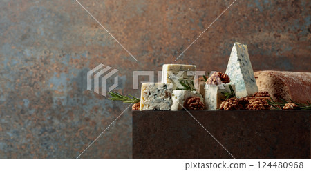 Blue cheese with walnuts, rustic bread, and fresh rosemary. 124480968