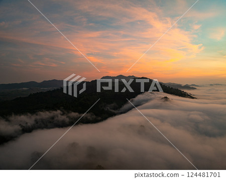 Aerial view Beautiful natural landscape Rainforest mountains in the sunrise or sunset time,Natural scenery tropical forest and fog in asia,Wide angle view drone shot Aerial view Beautiful natural landscape Rainforest mountains in the sunrise or sunset time,Natural scenery tropical forest and fog in asia,Wide angle view drone shot 124481701