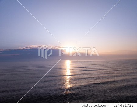 Aerial view sunset sky,Nature beautiful Light Sunset or sunrise over sea,Colorful dramatic majestic scenery sunset Sky with Amazing clouds and waves in sunset sky purple light cloud background Aerial view sunset sky,Nature beautiful Light Sunset or sunrise over sea,Colorful dramatic majestic scenery sunset Sky with Amazing clouds and waves in sunset sky purple light cloud background 124481722