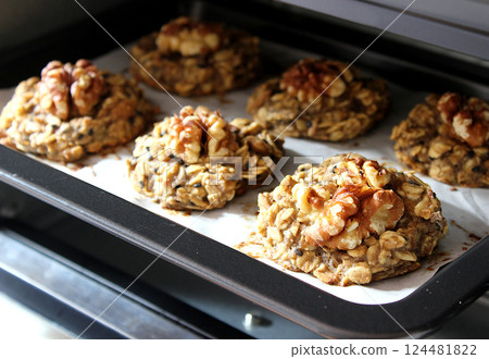 Homemade oat and banana cookies in the oven, dessert for vegan 124481822