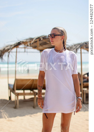 Chic Beach Outfit Enjoy a Relaxing Day by the Shore in Comfort and Style this Summer Chic Beach Outfit Enjoy a Relaxing Day by the Shore in Comfort and Style this Summer 124482077