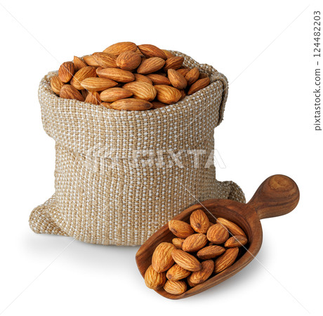 Almond nuts in burlap bag and wooden scoop isolated on white background 124482203