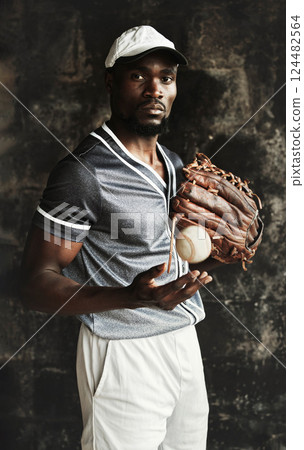 Black man, baseball player and motivation for fitness, training and exercise with ball, baseball glove and mitten. Portrait, sports athlete and softball player with health goals and wellness vision 124482564