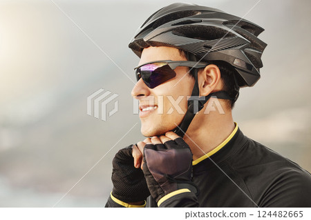 Fitness, sports and cyclist checking his helmet before cycling, training, workout and cardio ride in nature. Health, biking and athletic man getting ready for cycle, happy, smile and relaxed training 124482665