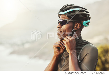 Mountain, helmet and motorcycle black man in marathon, fitness or sports competition on sky mock up marketing and advertising. Adventure training african athlete with safety gear for outdoor cycling 124482689