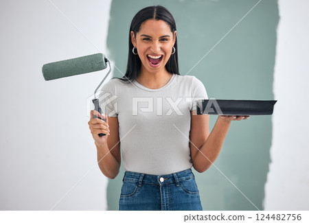 Home renovation, green paint and woman alone painting an interior wall of room with paint. Home improvement, DIY creative project and paint roller in hand ready for exciting remodeling of house Home renovation, green paint and woman alone painting an interior wall of room with paint. Home improvement, DIY creative project and paint roller in hand ready for exciting remodeling of house 124482756