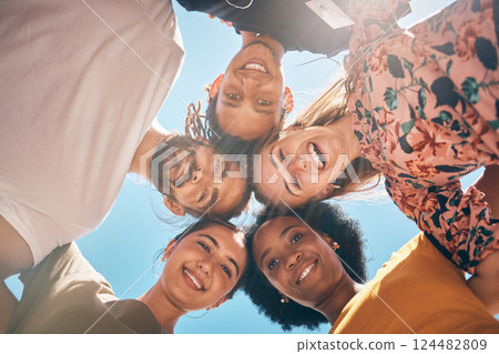 Friends, diversity and huddle with a man and woman group standing outdoor together on a blue sky in summer. Travel, smile and community with male and female people outside with a smile from below Friends, diversity and huddle with a man and woman group standing outdoor together on a blue sky in summer. Travel, smile and community with male and female people outside with a smile from below 124482809
