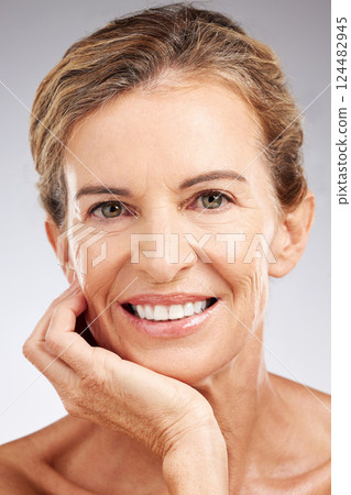 Skincare, face and portrait of senior woman in studio with beauty, cosmetic and health routine. Happy, smile and elderly lady with wrinkles isolated by gray background with wellness anti aging facial 124482945