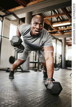 Fitness, gym and black man doing a workout with weights for strength, wellness and training. Bodybuilder, sports and strong African athlete doing push up exercise in a sport, health and active studio 124482959