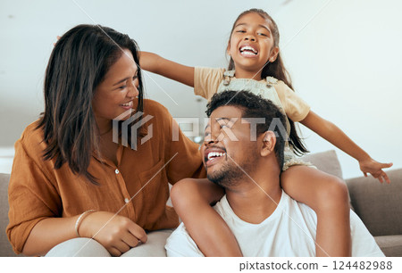 Happy family, love and relax on a sofa in a living room, laughing and playing in their home together. Love, smile and happy girl having fun with parents, talking and enjoying a game with mom and dad Happy family, love and relax on a sofa in a living room, laughing and playing in their home together. Love, smile and happy girl having fun with parents, talking and enjoying a game with mom and dad 124482988